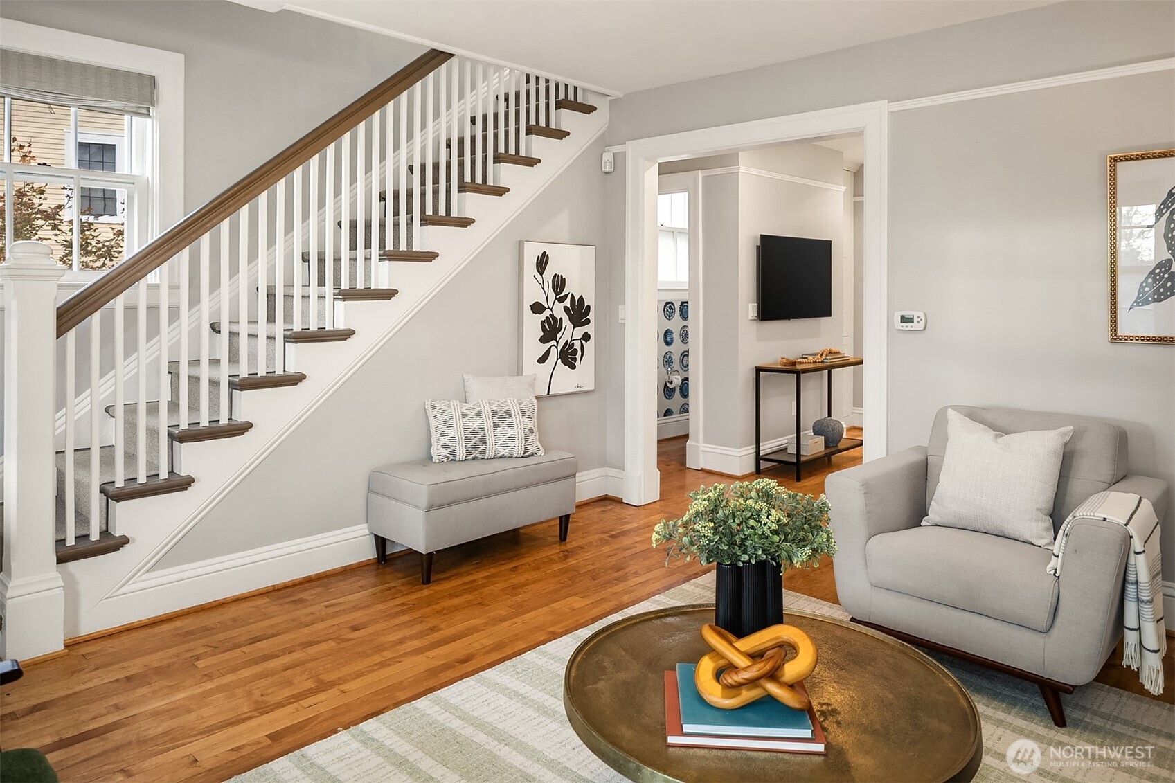 4422 Montana Circle Seattle, WA 98199 - Photo 5 of 32 a living room with furniture and a wooden floor