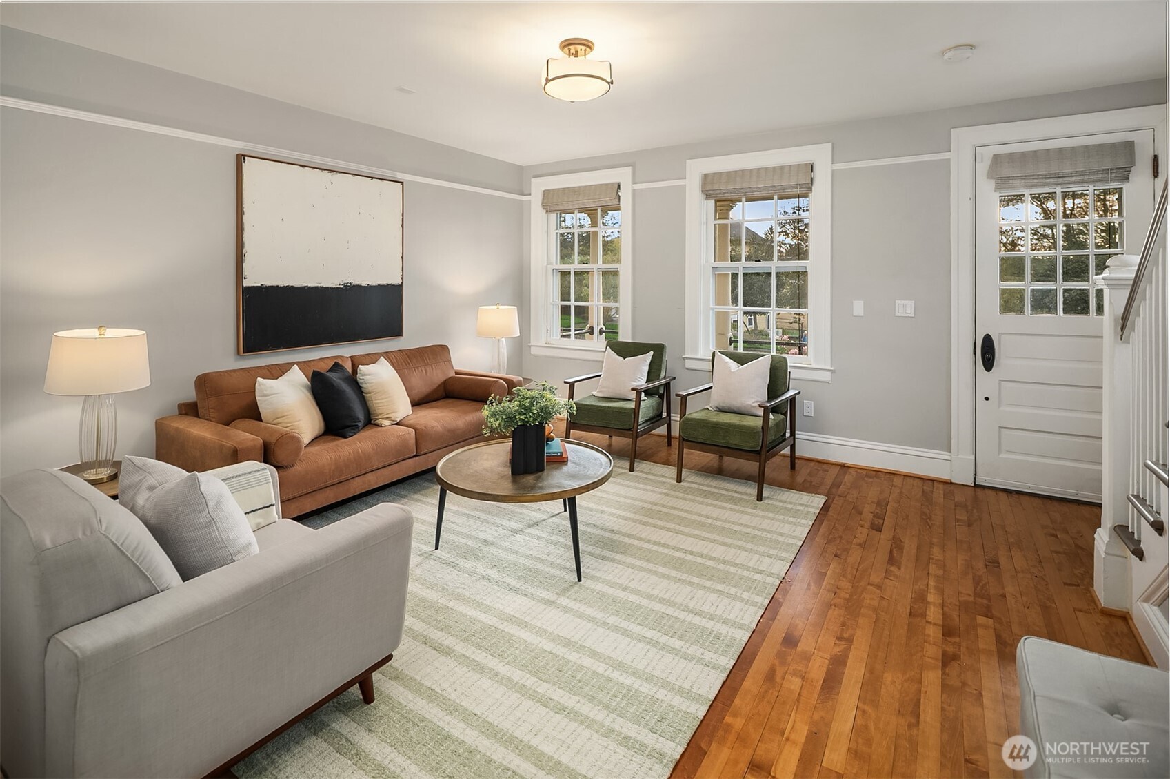 4422 Montana Circle Seattle, WA 98199 - Photo 7 of 32 a living room with furniture and wooden floor