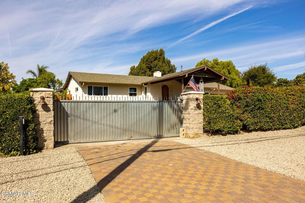 355 Avocado Place Camarillo, CA 93010 - Photo 1 of 1 a front view of a house with a yard and garage