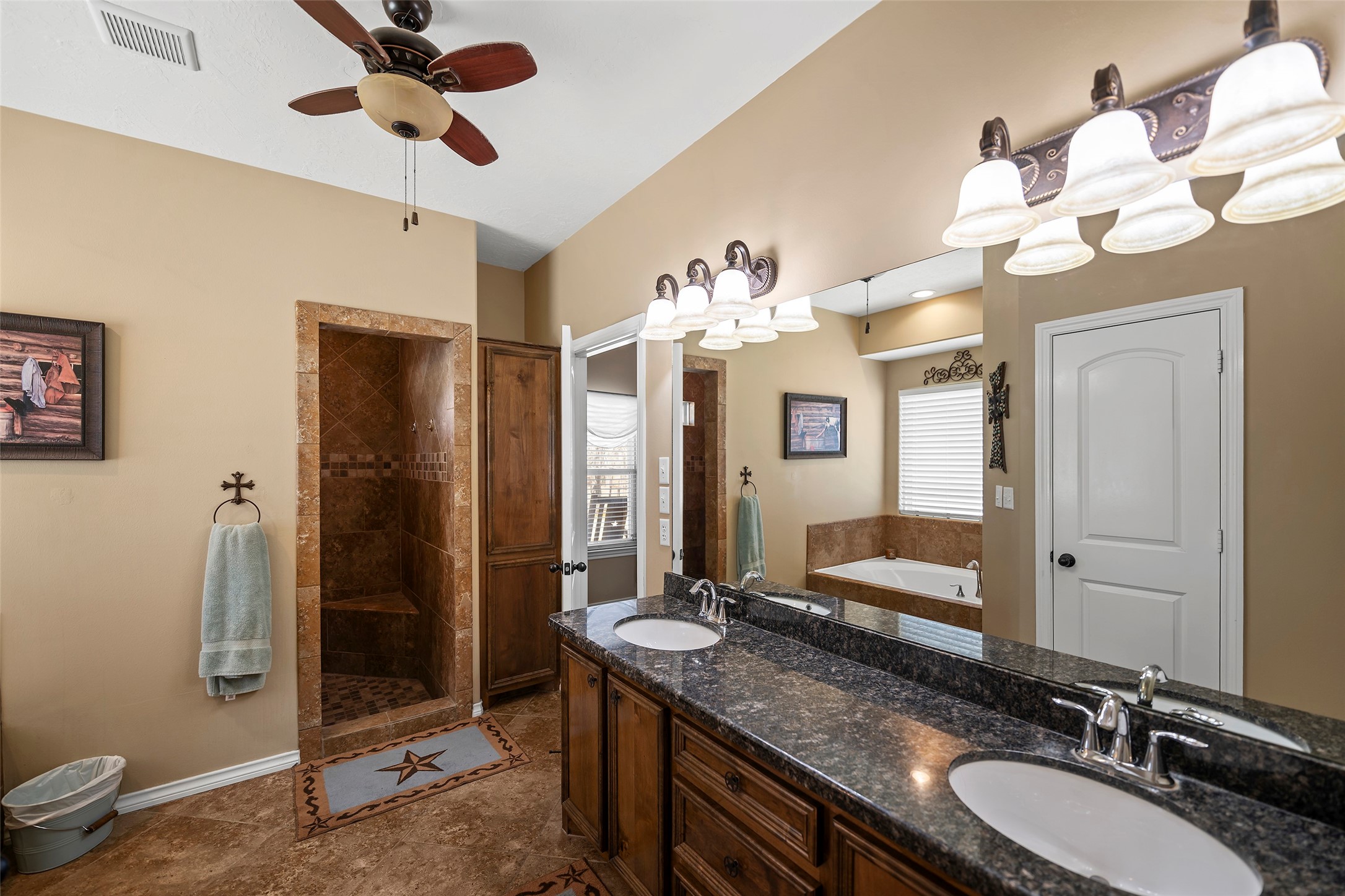 23530 Hargrave Road Hockley, TX 77447 - Photo 18 of 46 a bathroom with a granite countertop sink a toilet and a mirror