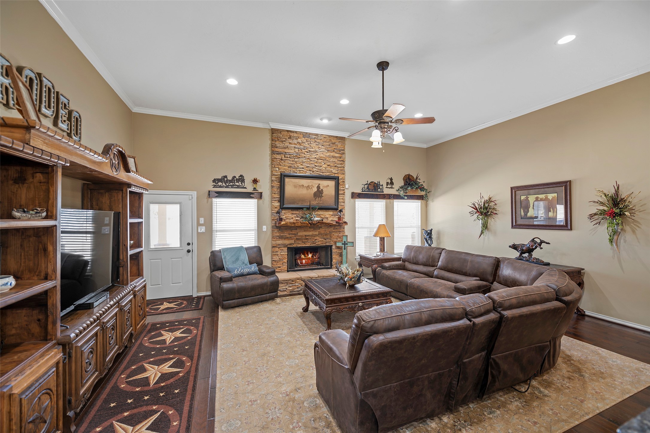 23530 Hargrave Road Hockley, TX 77447 - Photo 28 of 46 a living room with fireplace furniture and a flat screen tv