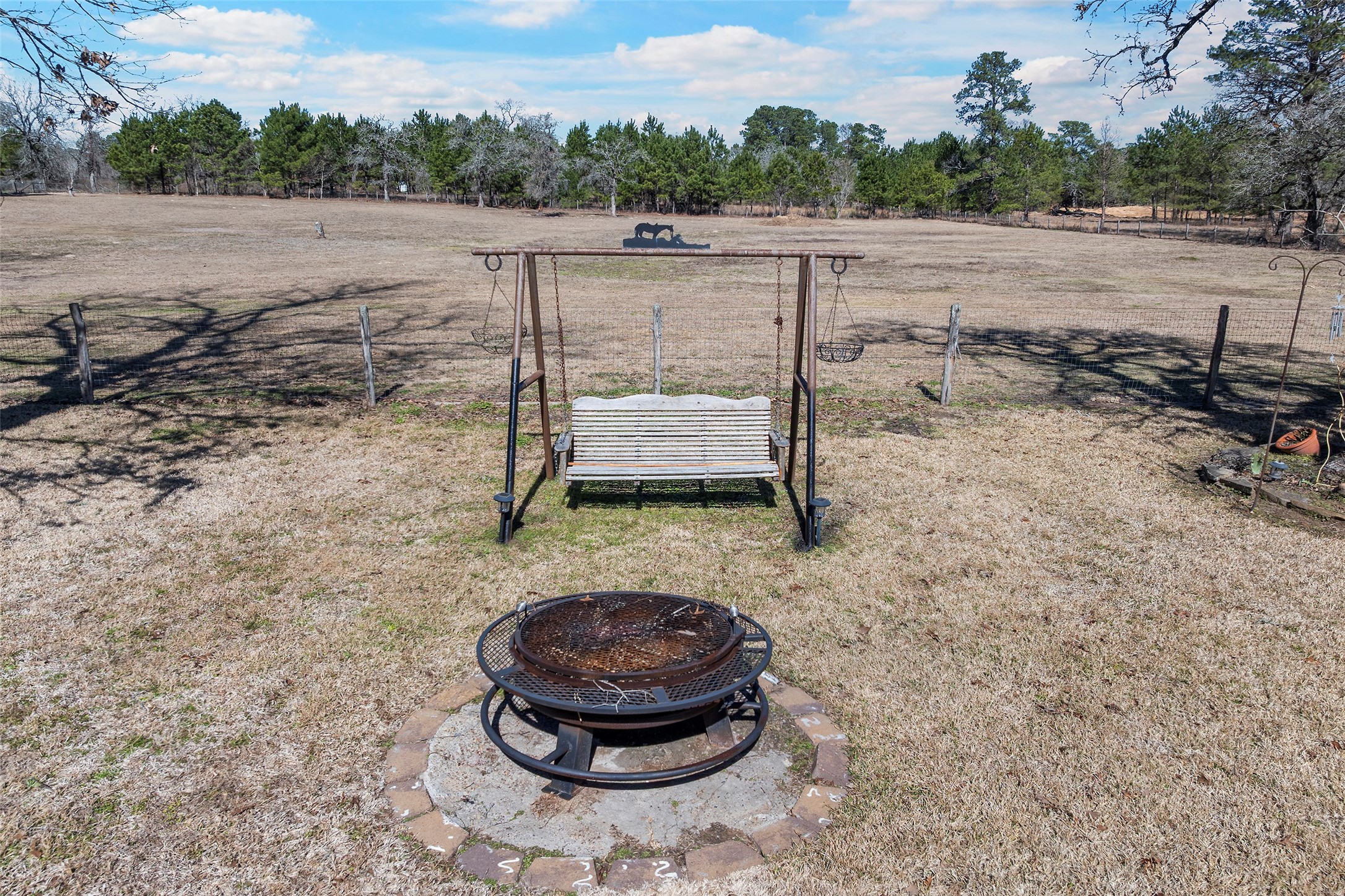 23530 Hargrave Road Hockley, TX 77447 - Photo 42 of 46 a view of a backyard with wooden floor and a fire pit