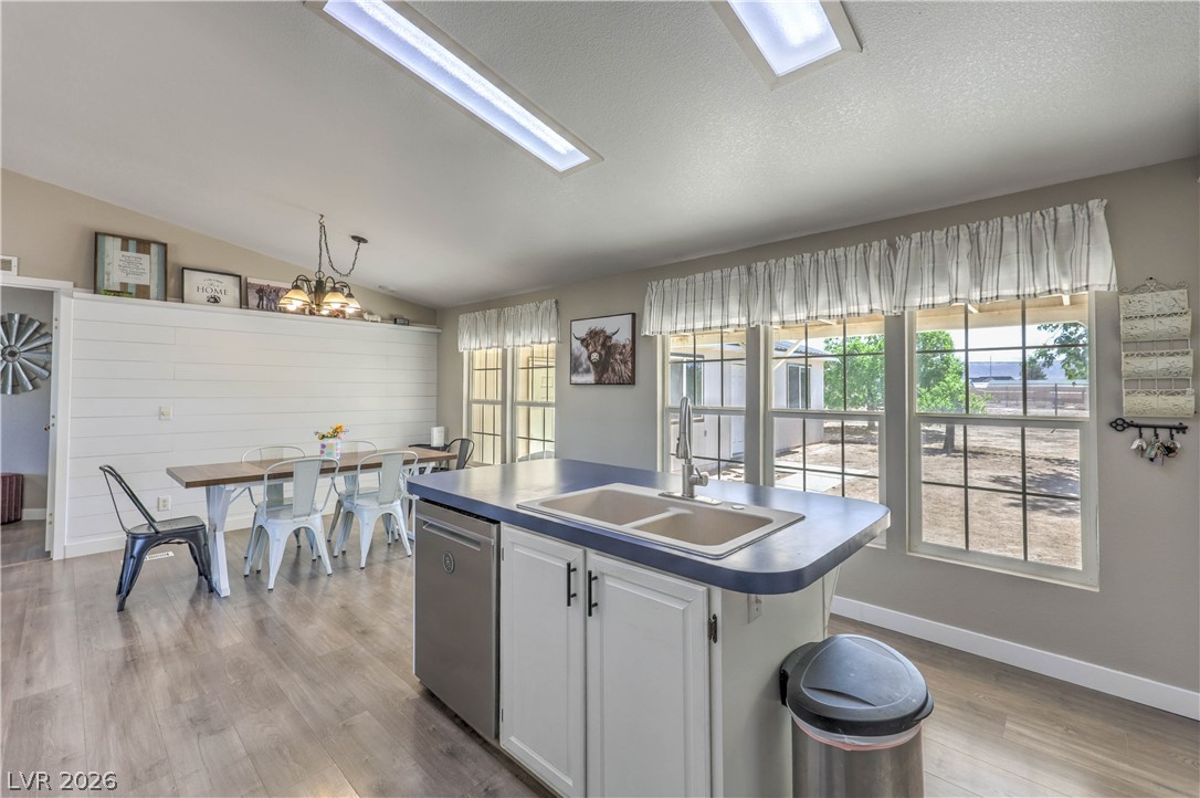 348 Tres Palomas Street Overton, NV 89040 - Photo 15 of 41 A well-lit kitchen and dining area features abundant natural light and modern finishes, perfect for gathering.