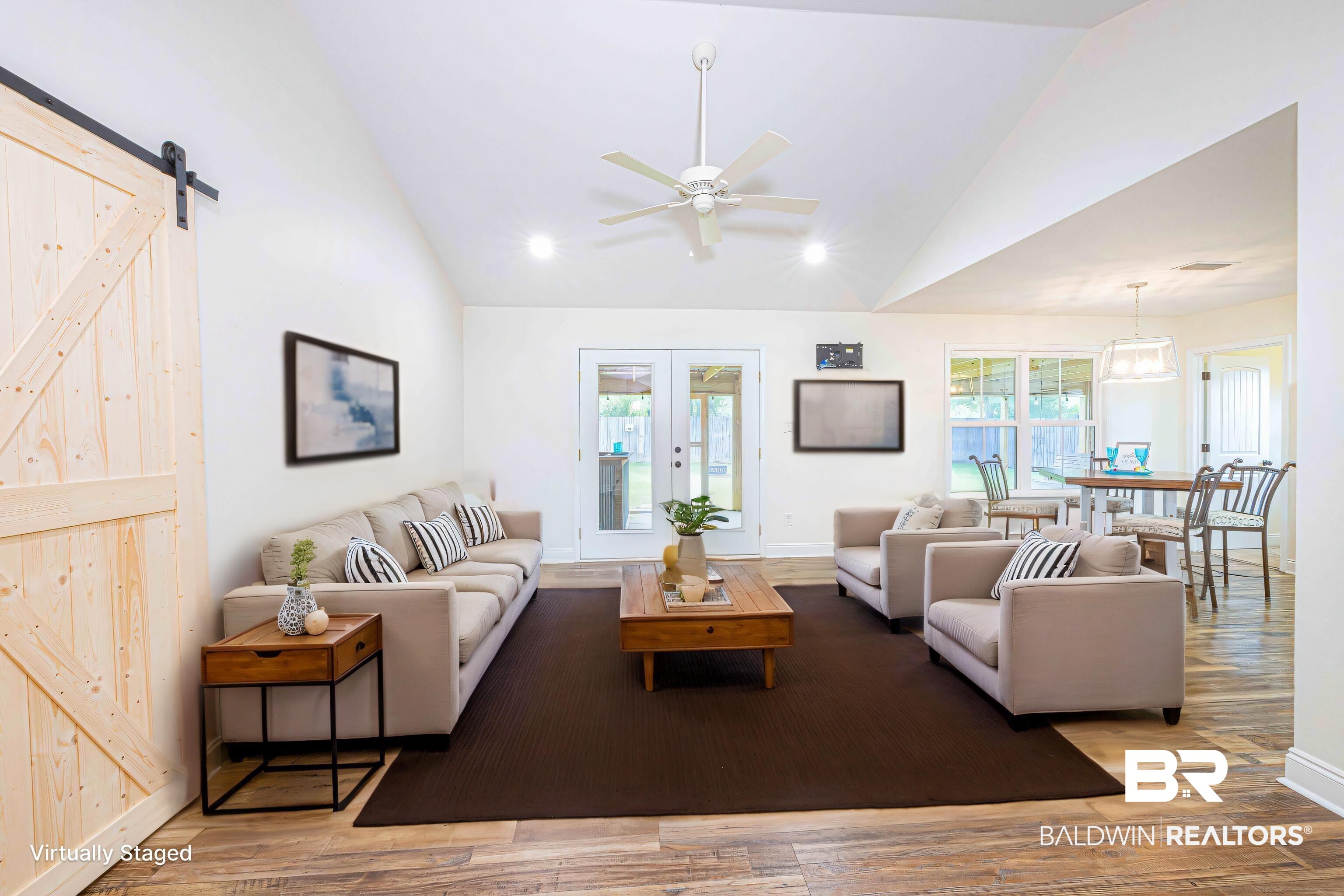 18675 Explorer Drive Loxley, AL 36551 - Photo 6 of 42 Living area featuring wood finished floors, a ceiling fan, a barn door, baseboards, and recessed lighting