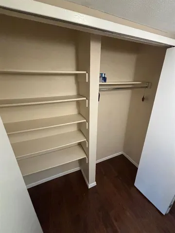 a view of an empty walk in closet