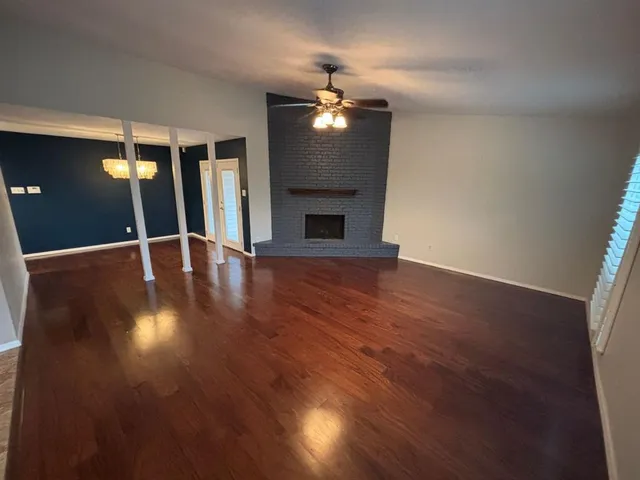 a view of a livingroom with wooden floor