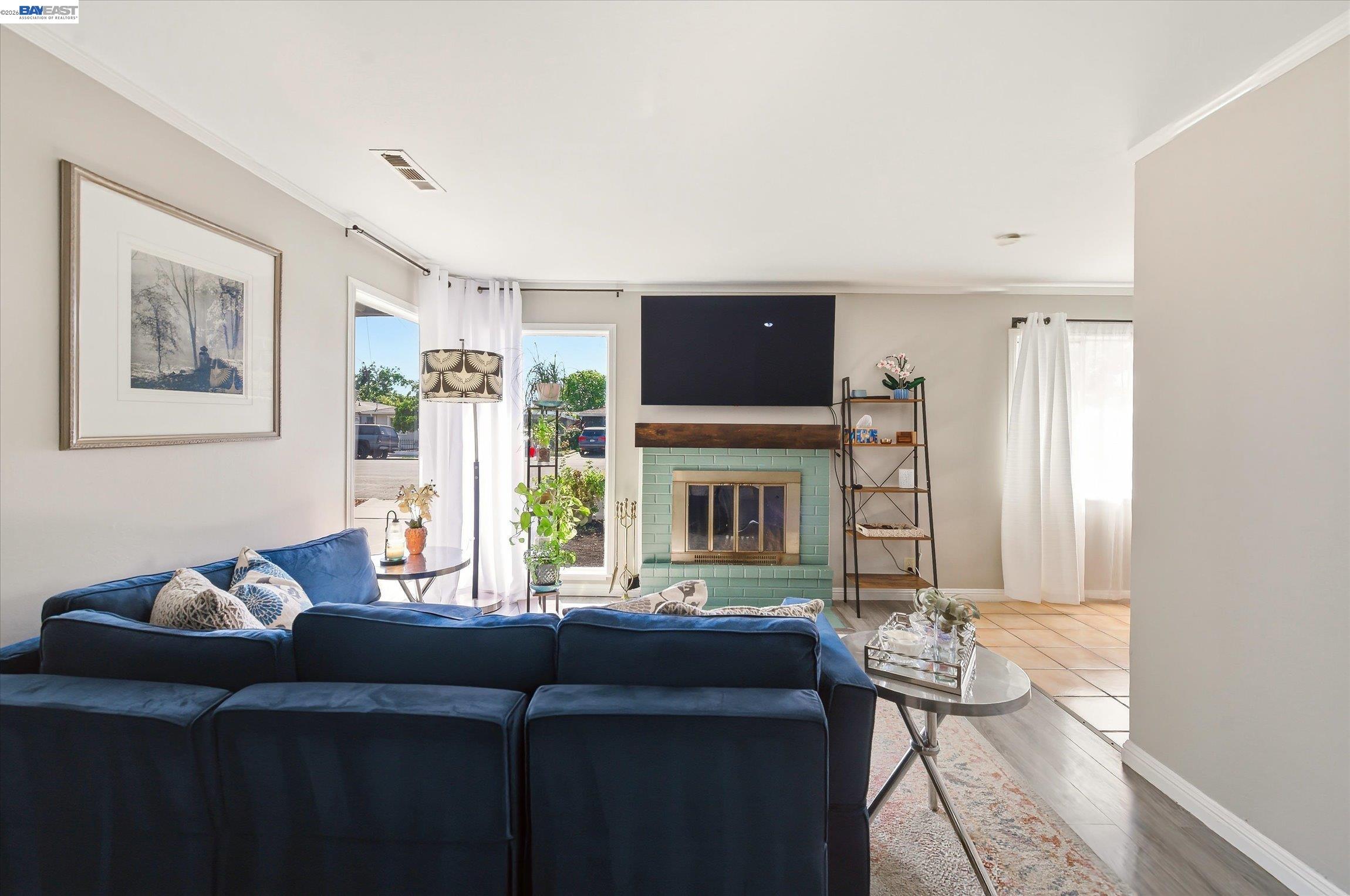 442 James Street Livermore, CA 94551 - Photo 1 of 28 a living room with furniture a fireplace and a flat screen tv