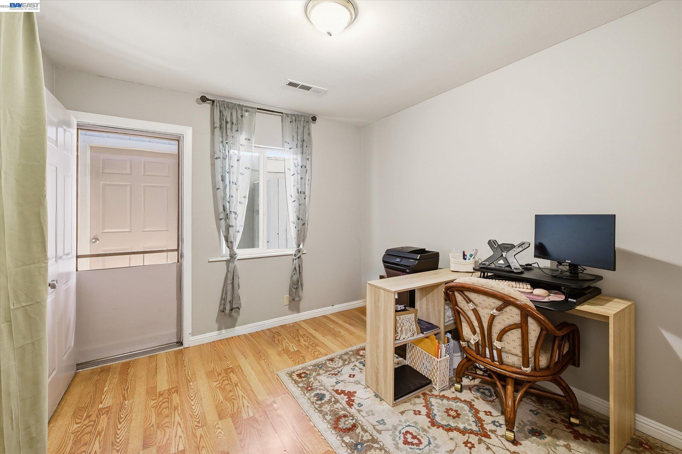 442 James Street Livermore, CA 94551 - Photo 16 of 28 a view of a workspace with furniture and a window