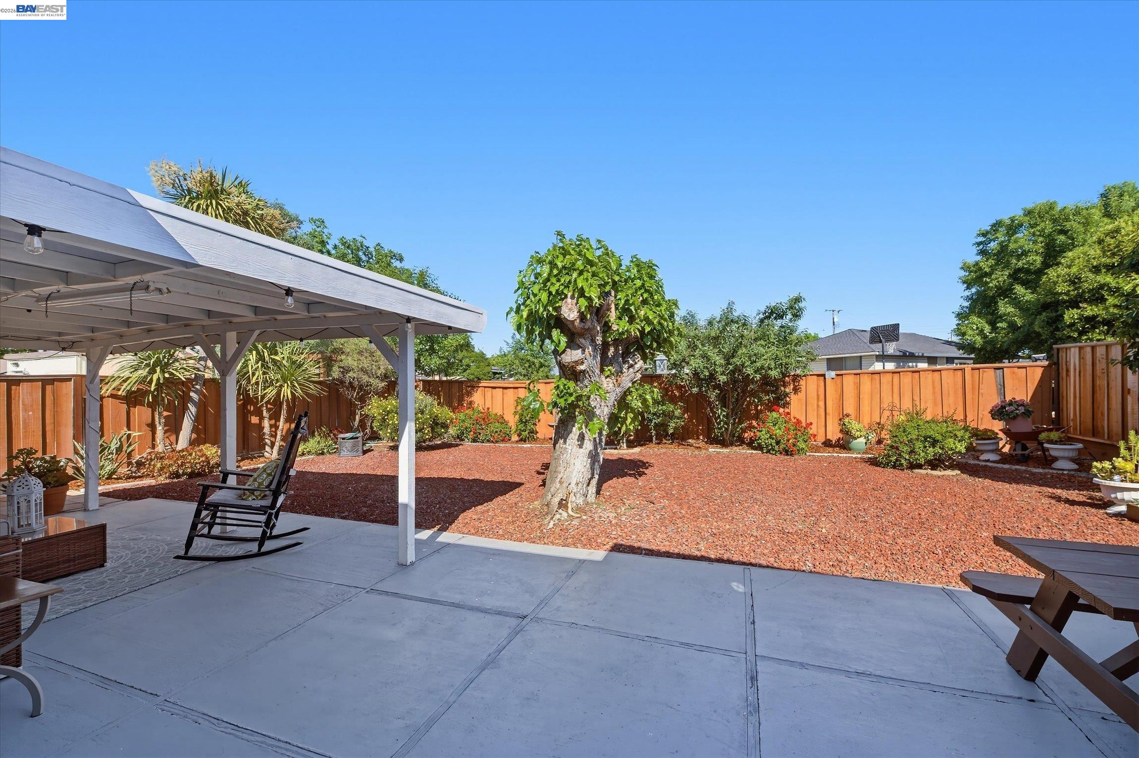 442 James Street Livermore, CA 94551 - Photo 20 of 28 a patio with table and chairs and potted plants