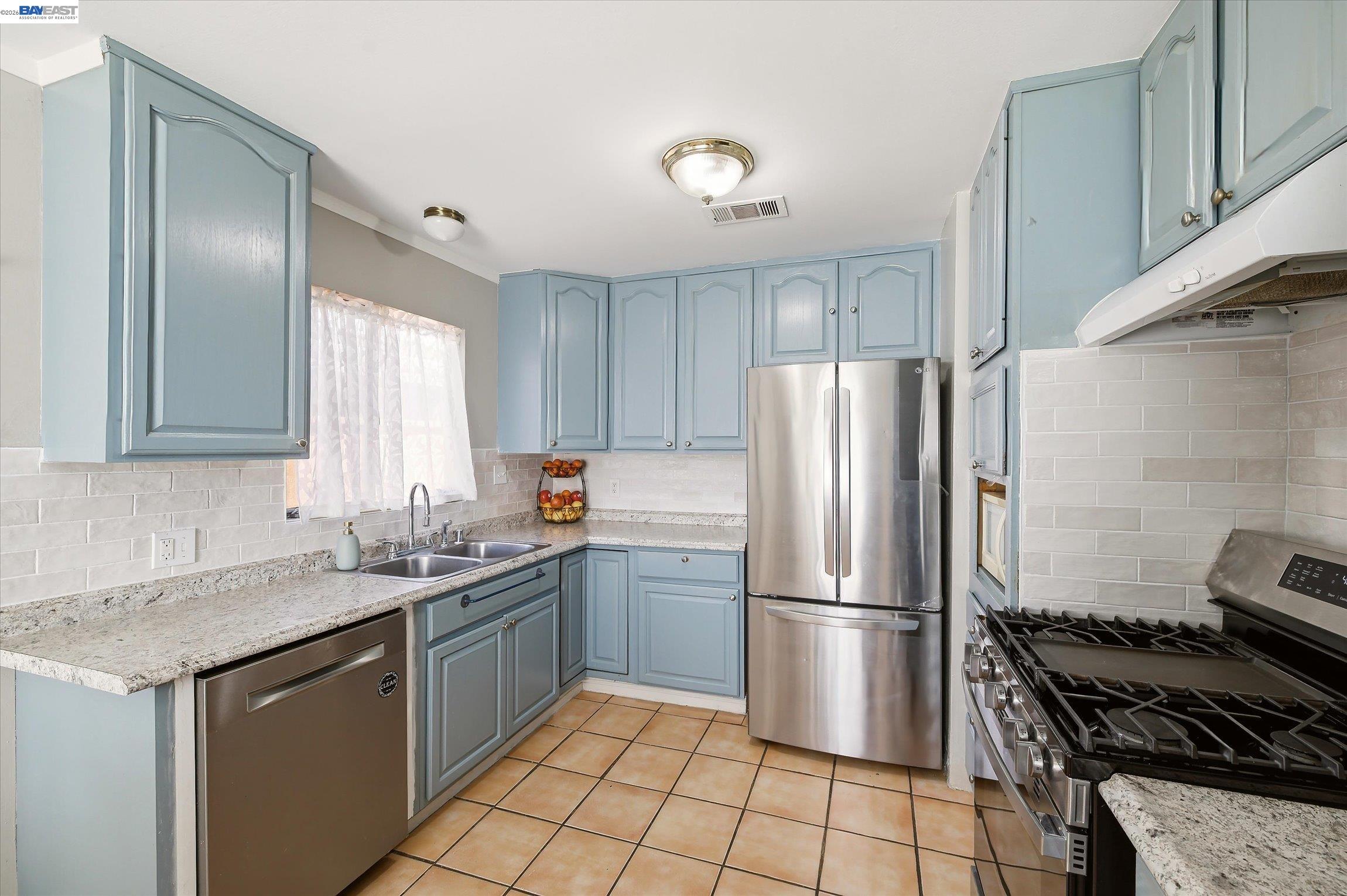 442 James Street Livermore, CA 94551 - Photo 6 of 28 a kitchen with a sink stove and refrigerator