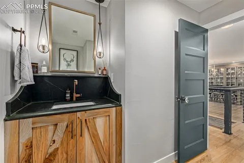 a bathroom with a sink a mirror and a shower