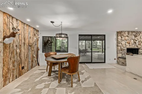 a dining room with furniture and window