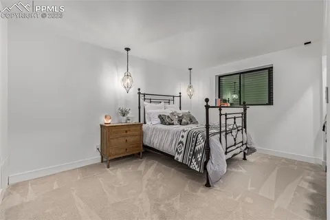 a bed room with furniture and a window