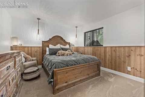 a spacious bedroom with a bed and a couch