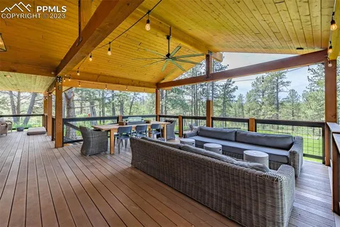 a view of a patio with wooden floor