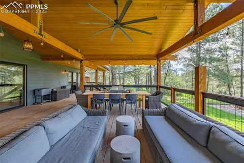 a view of a two chairs in the balcony