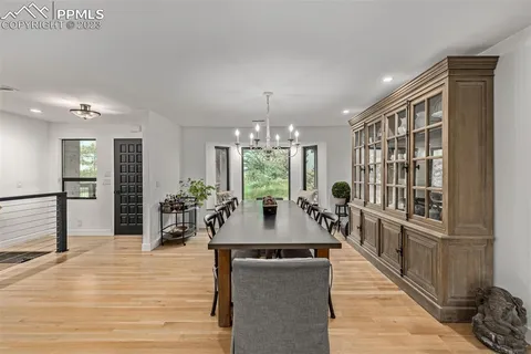 a view of a dining room with furniture window and wooden floor