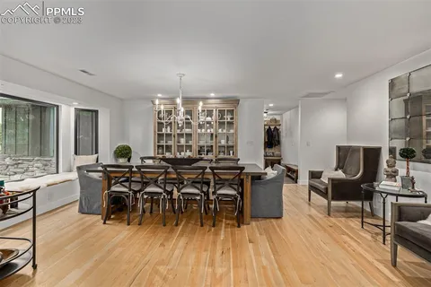 a view of a dining room with furniture window and wooden floor