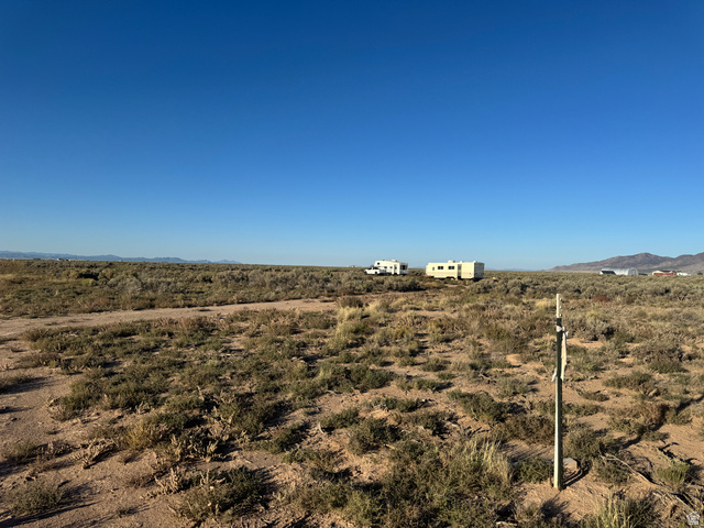 2341 East Castle Avenue Beryl, UT 84714 - Photo 13 of 18 View of yard with a mountain view and a view of rural / pastoral area