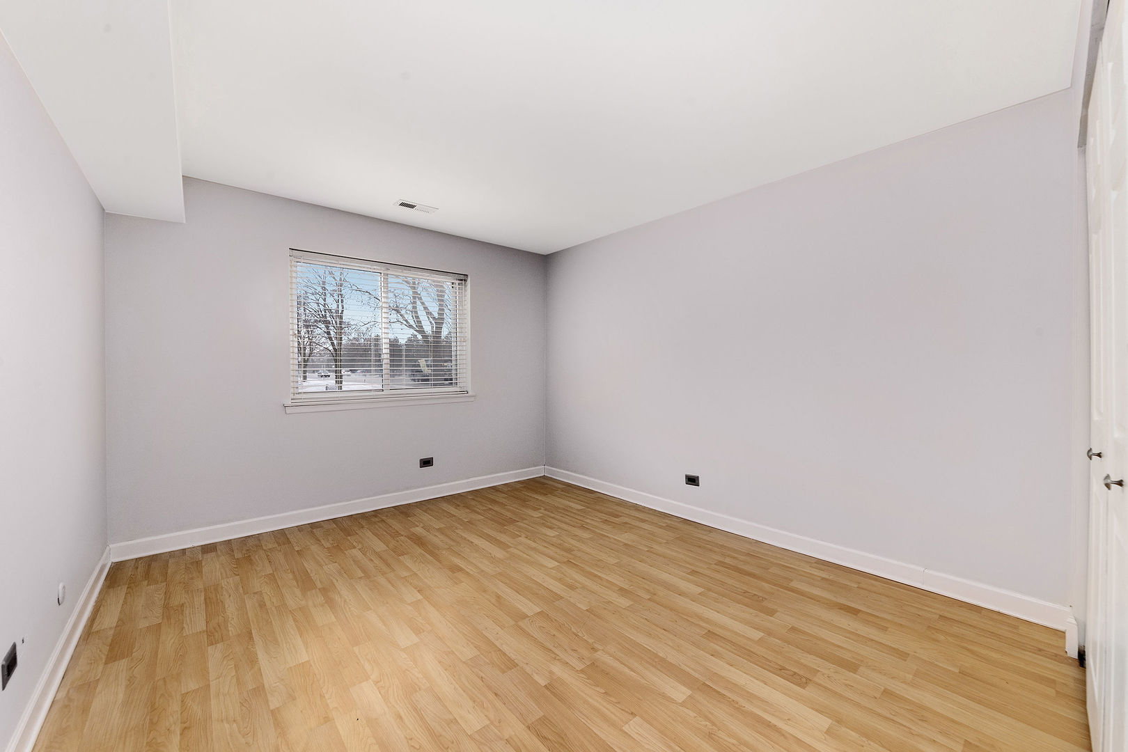 912 South Plum Grove Road, Unit 121 Palatine, IL 60067 - Photo 9 of 11 a view of empty room with wooden floor
