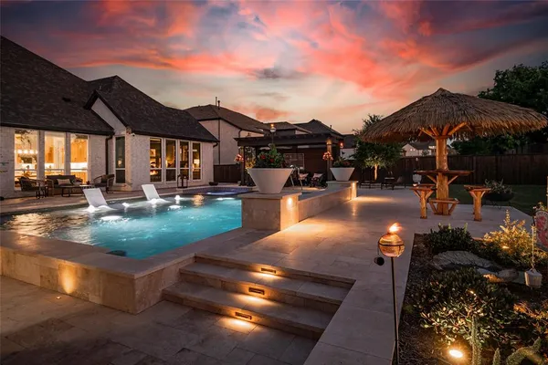 a view of a patio with swimming pool table and chairs