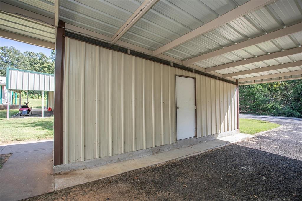 457 Neals Hill Road Oak Ridge, TX 76240 - Photo 10 of 14 View of garage