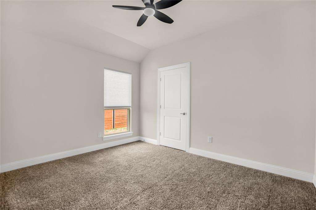 3616 Pinto Way Aubrey, TX 76227 - Photo 11 of 38 an empty room with a window and a ceiling fan