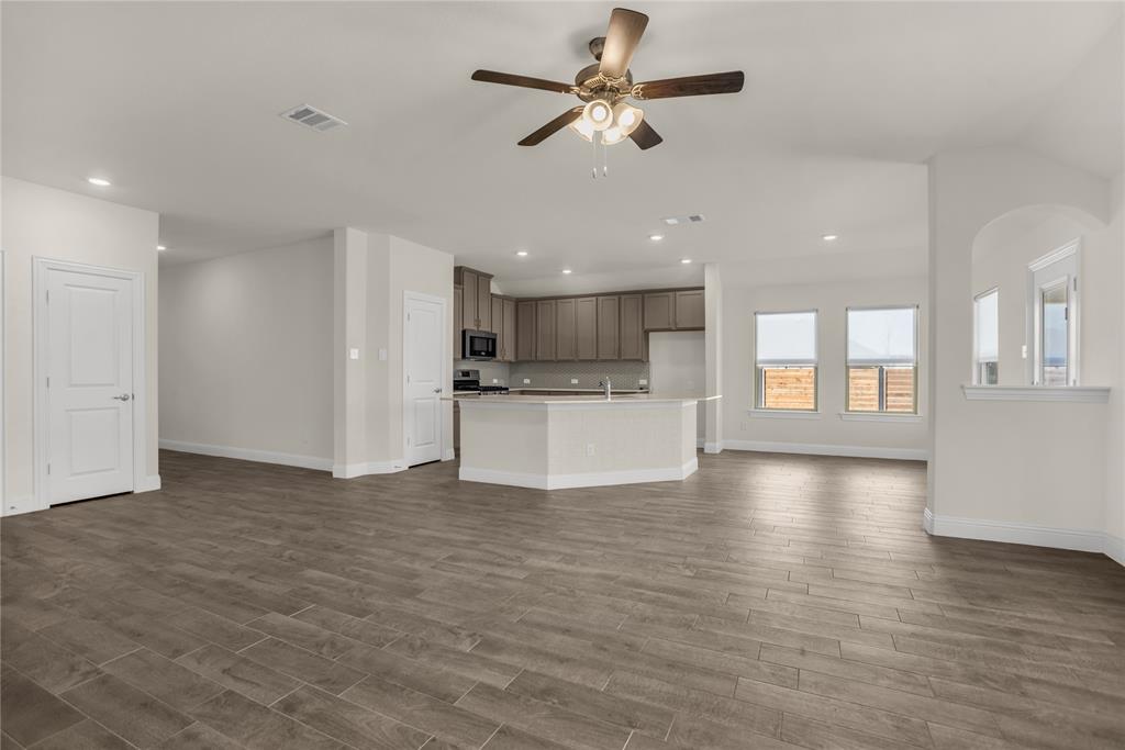 3616 Pinto Way Aubrey, TX 76227 - Photo 15 of 38 a view of a kitchen with a stove cabinets and wooden floor