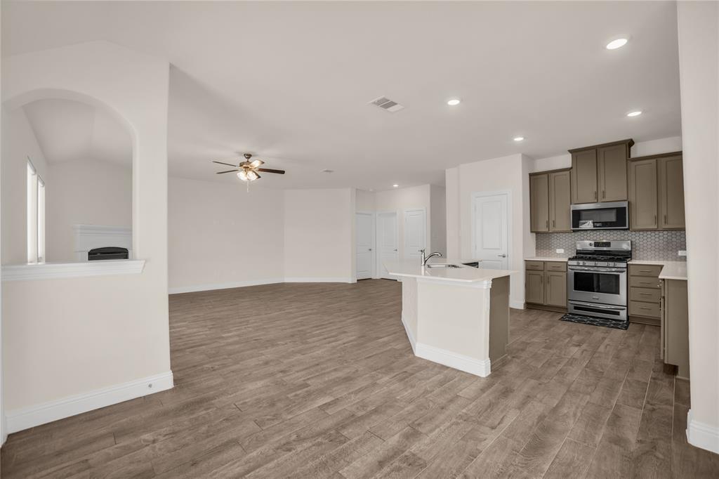 3616 Pinto Way Aubrey, TX 76227 - Photo 20 of 38 a view of kitchen with wooden floor and electronic appliances