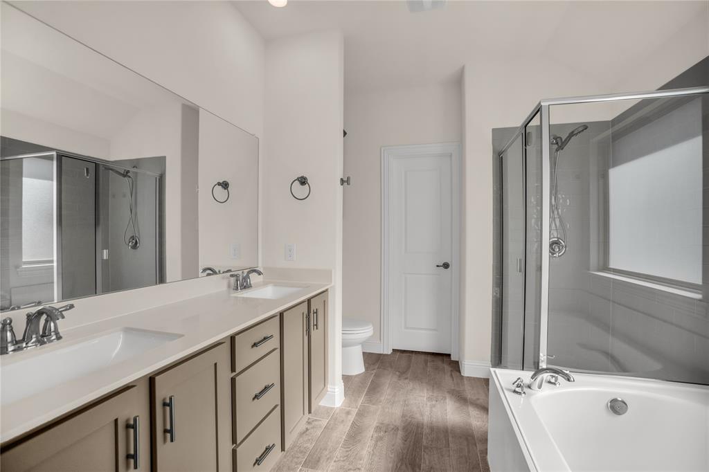 3616 Pinto Way Aubrey, TX 76227 - Photo 24 of 38 a bathroom with a double vanity sink mirror and shower