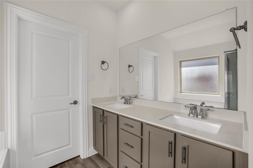 3616 Pinto Way Aubrey, TX 76227 - Photo 25 of 38 a bathroom with a sink and a mirror