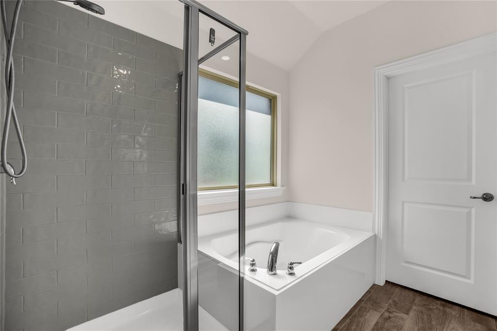 3616 Pinto Way Aubrey, TX 76227 - Photo 26 of 38 a bathroom with a tub and shower