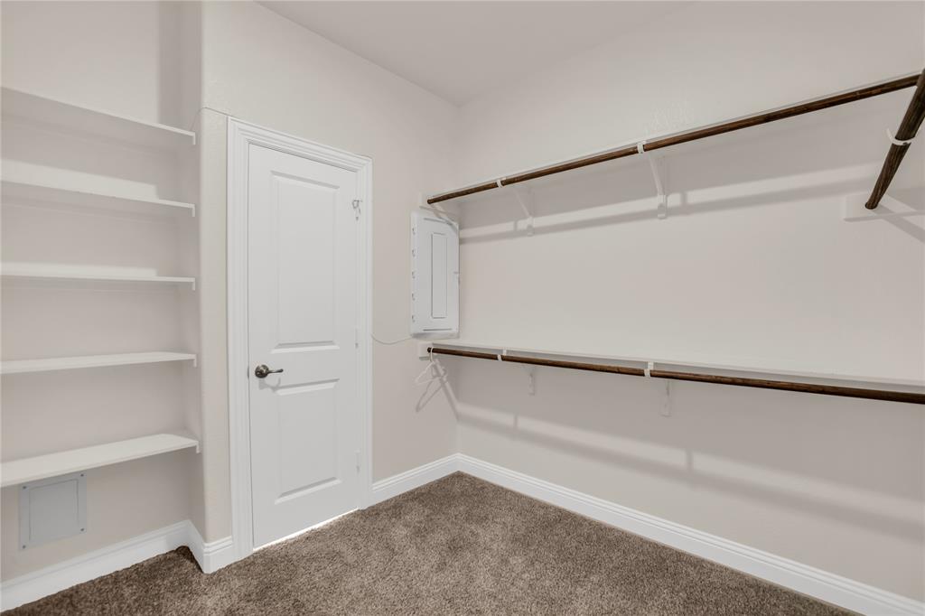 3616 Pinto Way Aubrey, TX 76227 - Photo 28 of 38 a view of an empty walk in closet