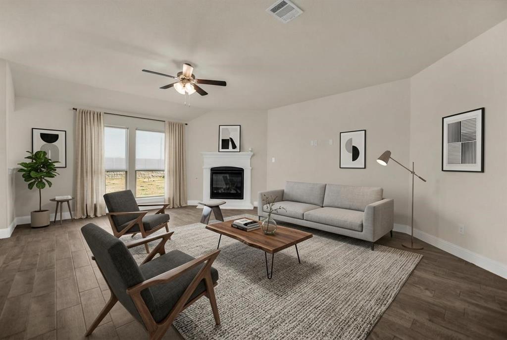 3616 Pinto Way Aubrey, TX 76227 - Photo 3 of 38 a living room with furniture and a fireplace