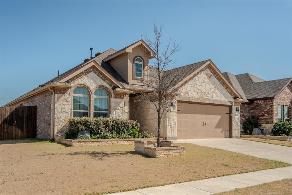 3616 Pinto Way Aubrey, TX 76227 - Photo 34 of 38 a front view of a house with garden