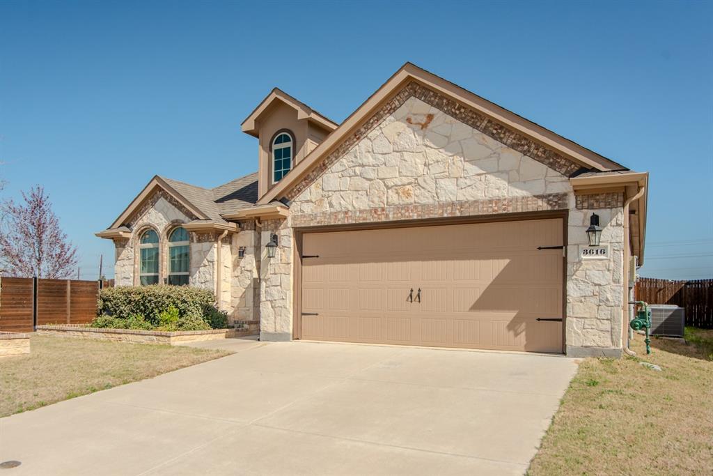 3616 Pinto Way Aubrey, TX 76227 - Photo 35 of 38 a front view of a house with a yard and garage