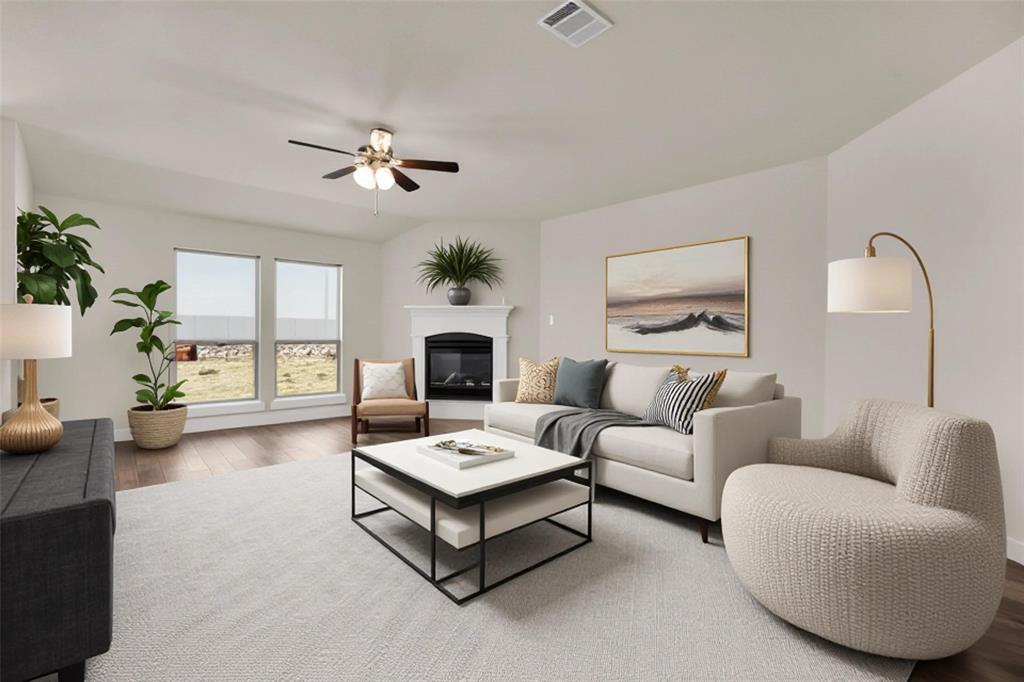 3616 Pinto Way Aubrey, TX 76227 - Photo 6 of 38 a living room with furniture and a fireplace