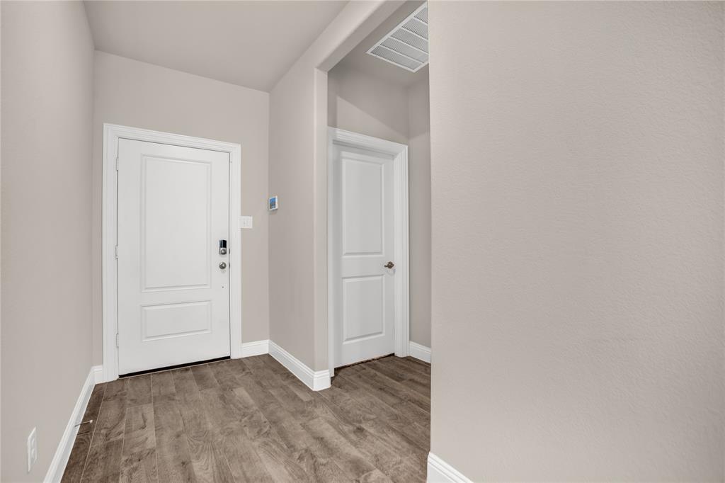 3616 Pinto Way Aubrey, TX 76227 - Photo 7 of 38 a view of a room with wooden floor