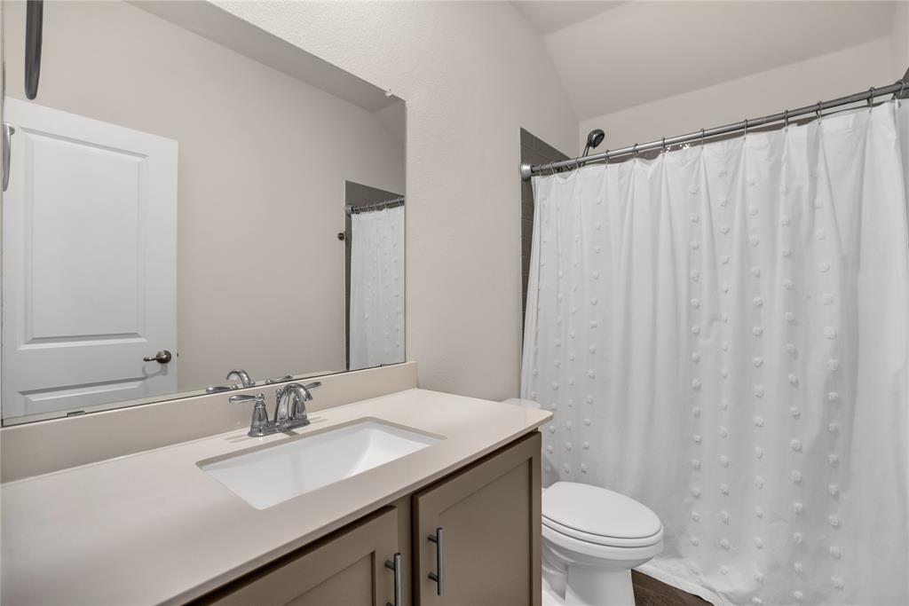 3616 Pinto Way Aubrey, TX 76227 - Photo 10 of 38 a bathroom with a sink toilet and shower