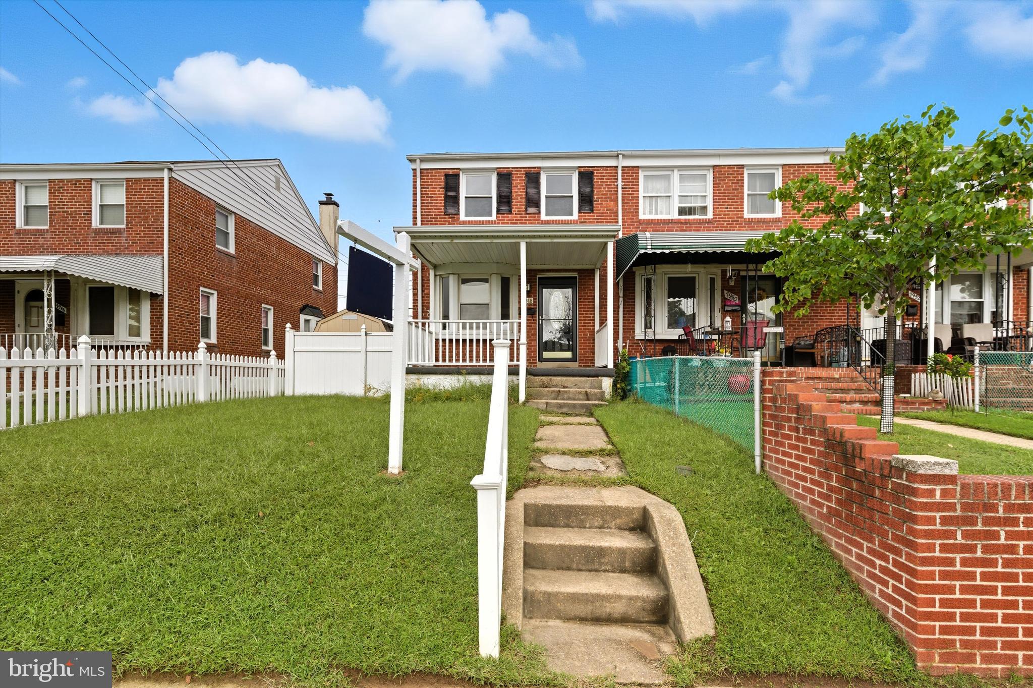7948 Kavanagh Road Baltimore, MD 21222 - Photo 3 of 26 a front view of a house with a yard