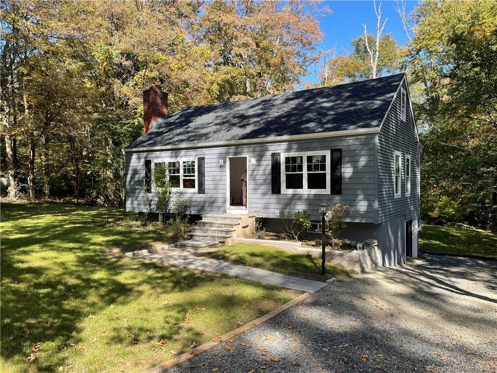 282 Old Sib Road Ridgefield, CT 06877 - Photo 1 of 1 a view of house with yard outdoor seating and covered with trees
