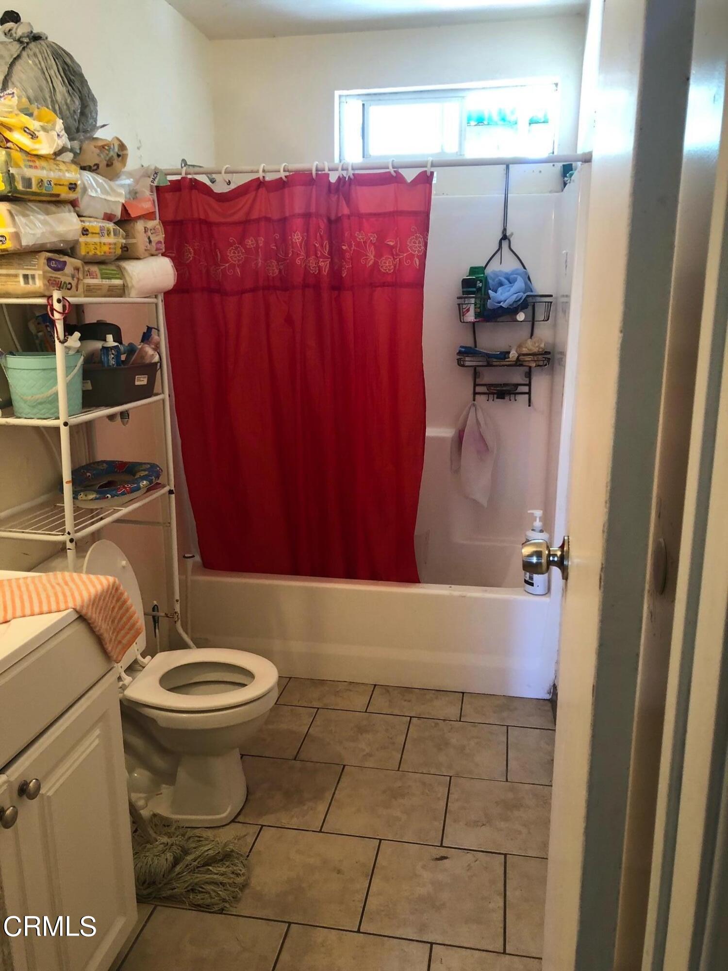 128 North Harrison Avenue Oxnard, CA 93030 - Photo 5 of 10 a bathroom with a toilet and a shower