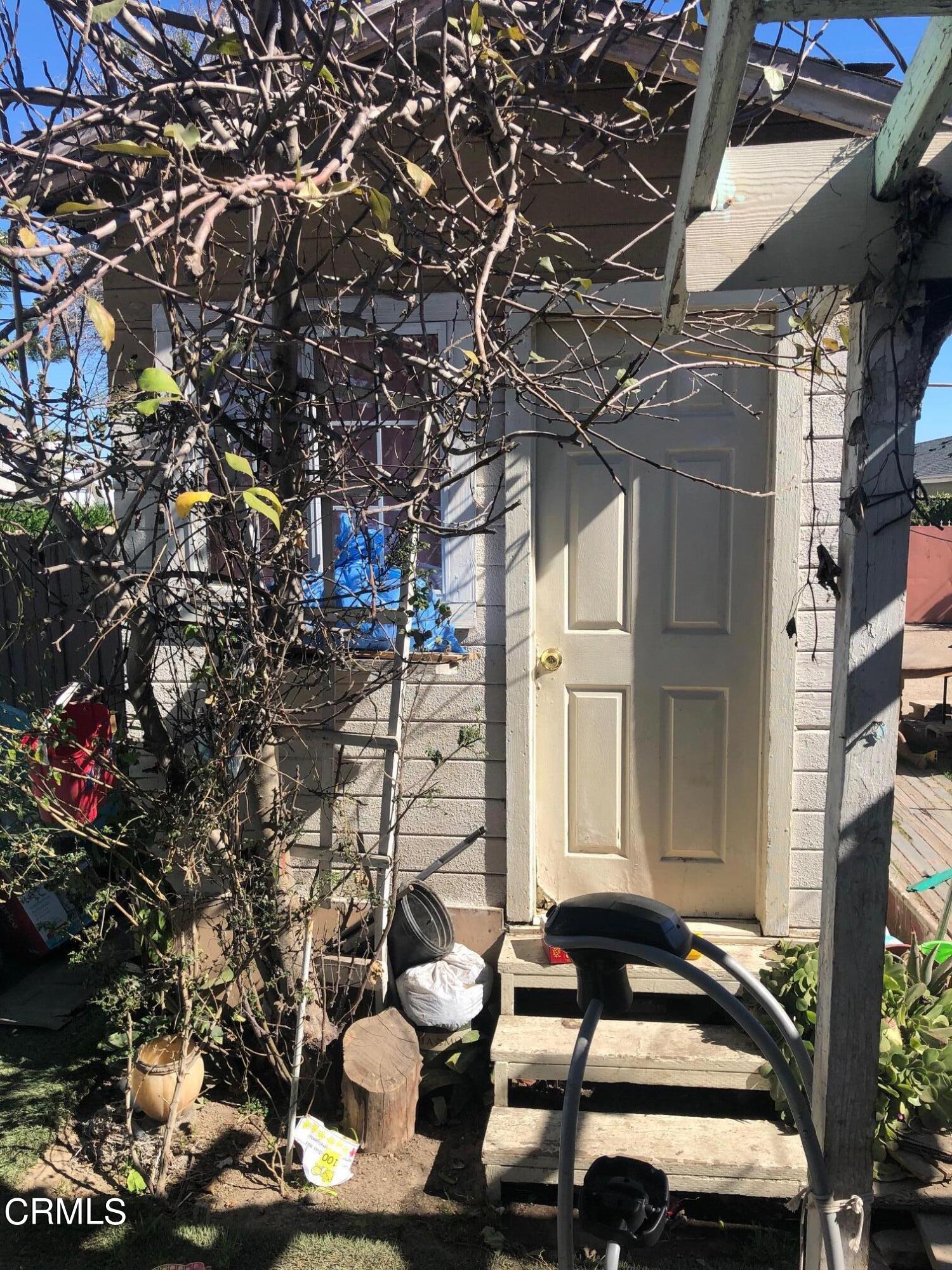 128 North Harrison Avenue Oxnard, CA 93030 - Photo 7 of 10 a couple of cars parked in front of building