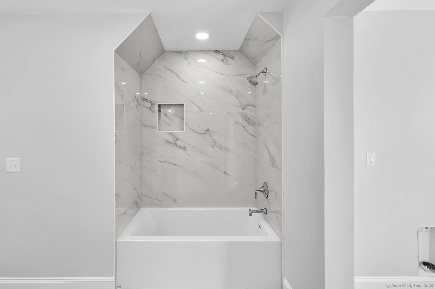 197 Vesper Street Fairfield, CT 06825 - Photo 17 of 21 a bathroom with a bathtub and a shower