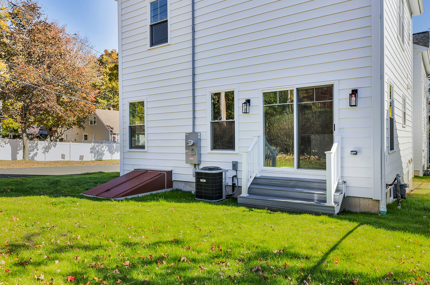 197 Vesper Street Fairfield, CT 06825 - Photo 4 of 21 a swimming pool with outdoor seating and yard