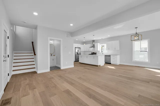 a view of a kitchen with a sink and a window