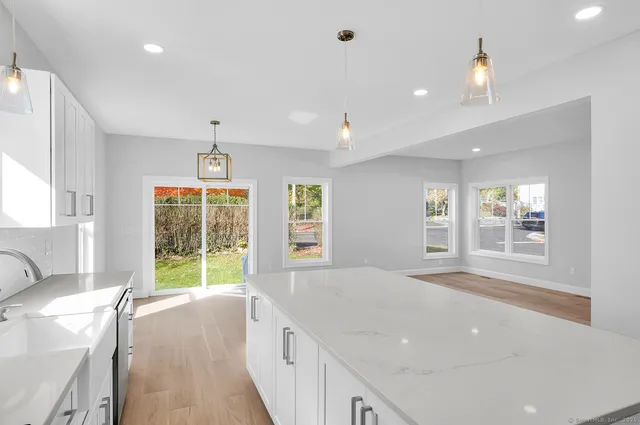 a spacious bedroom with a balcony a bed and a window