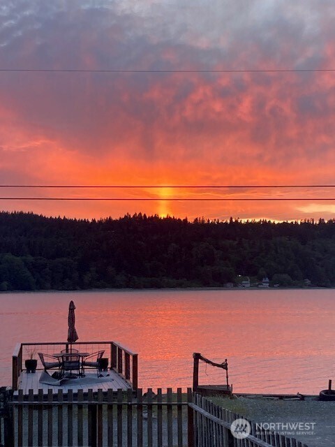 27728 Manzanita Beach Road Southwest Vashon, WA 98070 - Photo 4 of 17 a view of a terrace with a lake