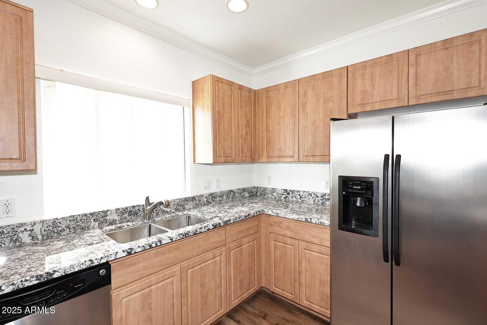 295 North Rural Road, Unit 164 Chandler, AZ 85226 - Photo 12 of 24 a kitchen with stainless steel appliances granite countertop a refrigerator and a sink