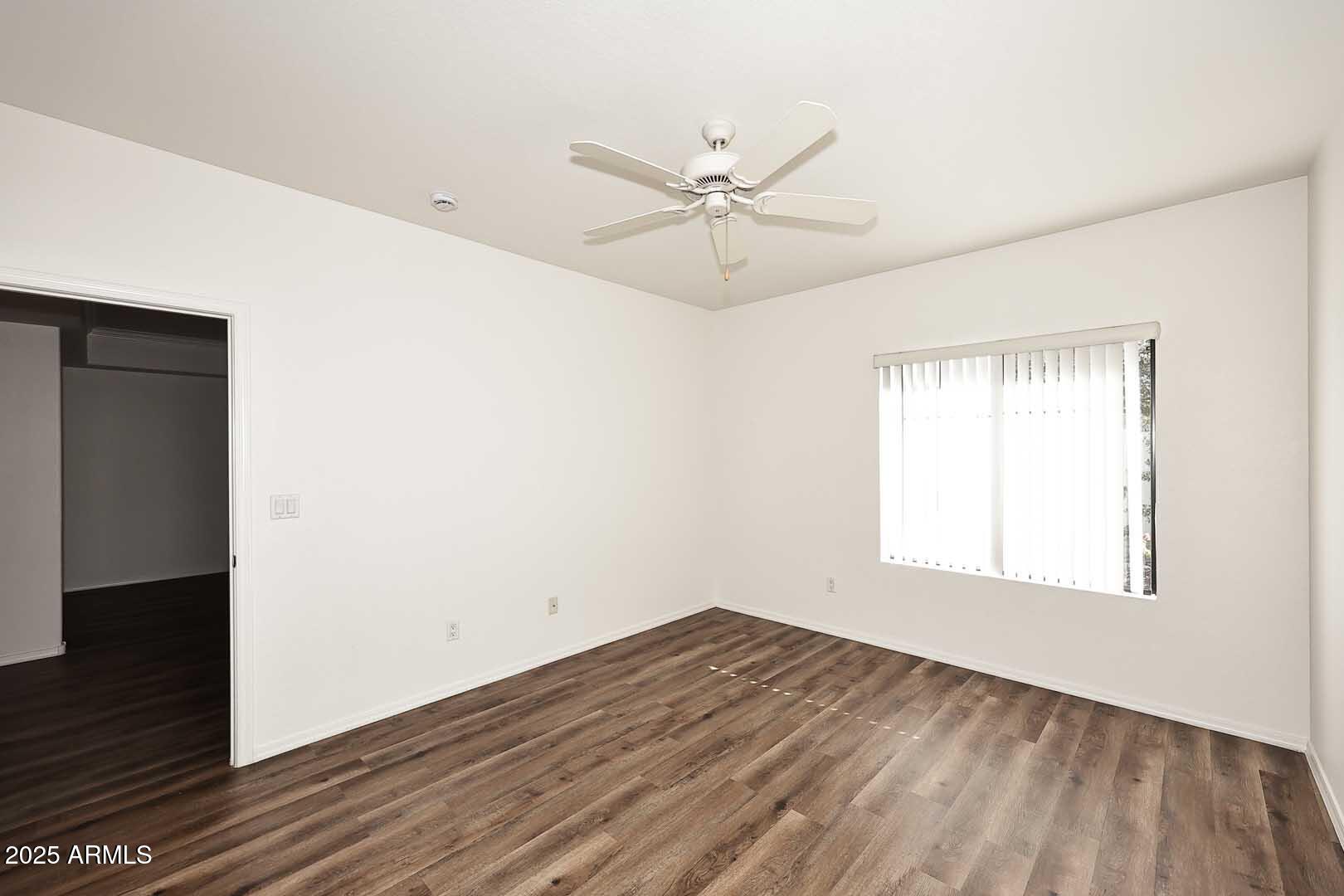 295 North Rural Road, Unit 164 Chandler, AZ 85226 - Photo 14 of 24 a view of empty room with wooden floor and fan